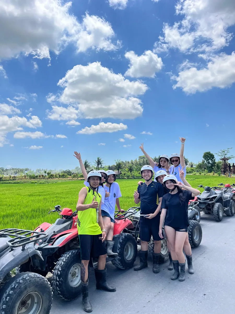ATV tour group near rice fields