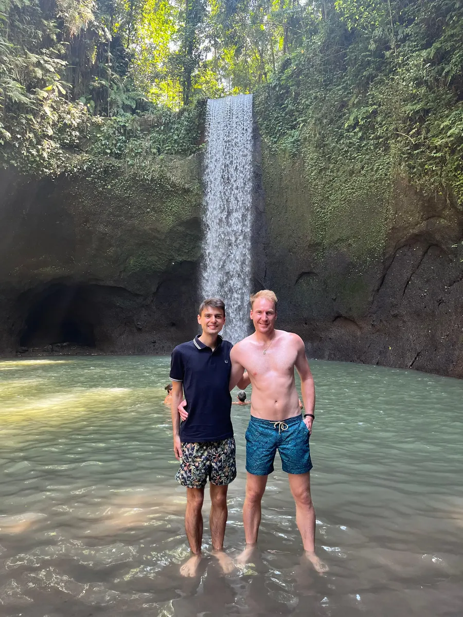 Guests enjoying a jungle waterfall pool